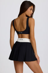 Soft Active Crossover Pleated Mini Skort in Black