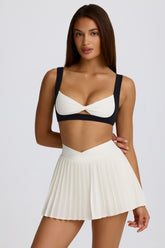 Soft Active Crossover Pleated Mini Skort in Ivory