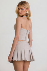 Low-Rise Pleated Mini Skirt in Ecru
