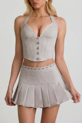 Low-Rise Pleated Mini Skirt in Ecru