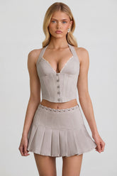 Low-Rise Pleated Mini Skirt in Ecru