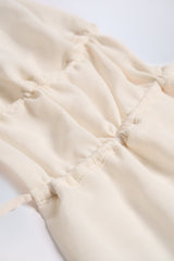 Cut-Out Semi-Sheer Ruched Halterneck Crop Top in Ivory